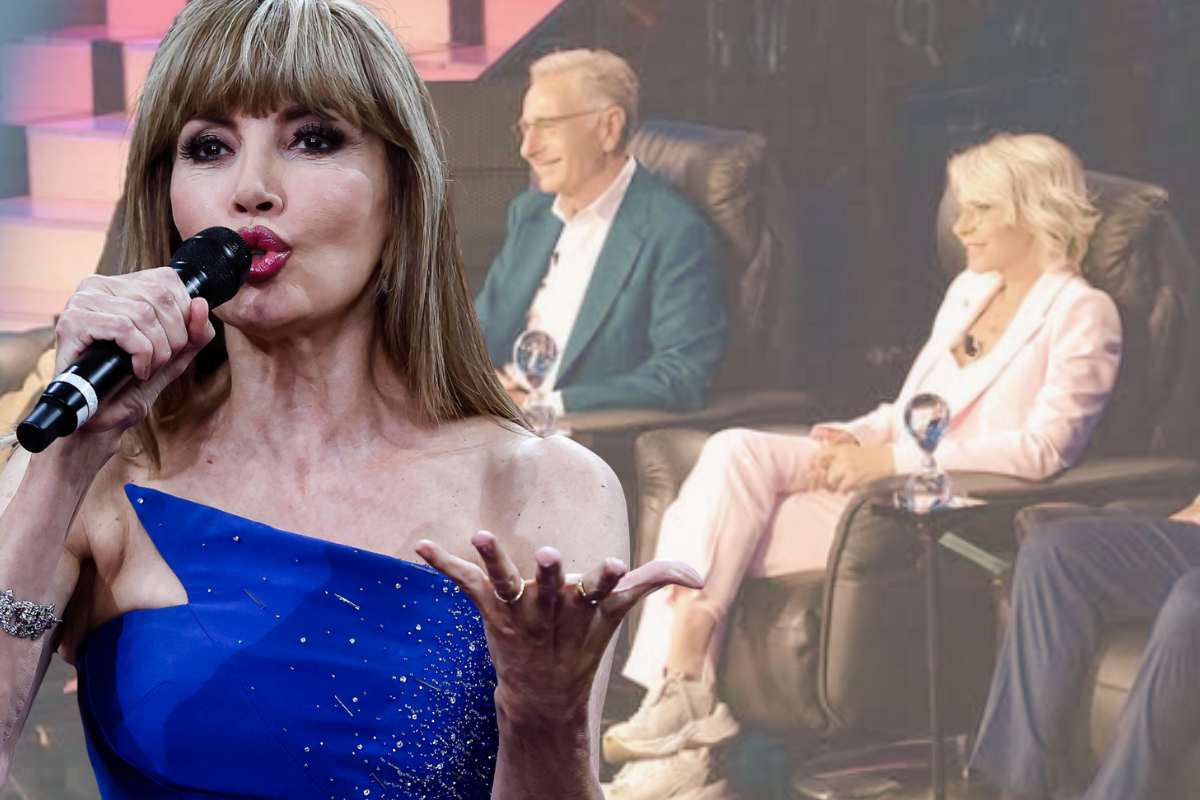 Milly Carlucci e nello sfondo Paolo Bonolis e Maria De Filippi